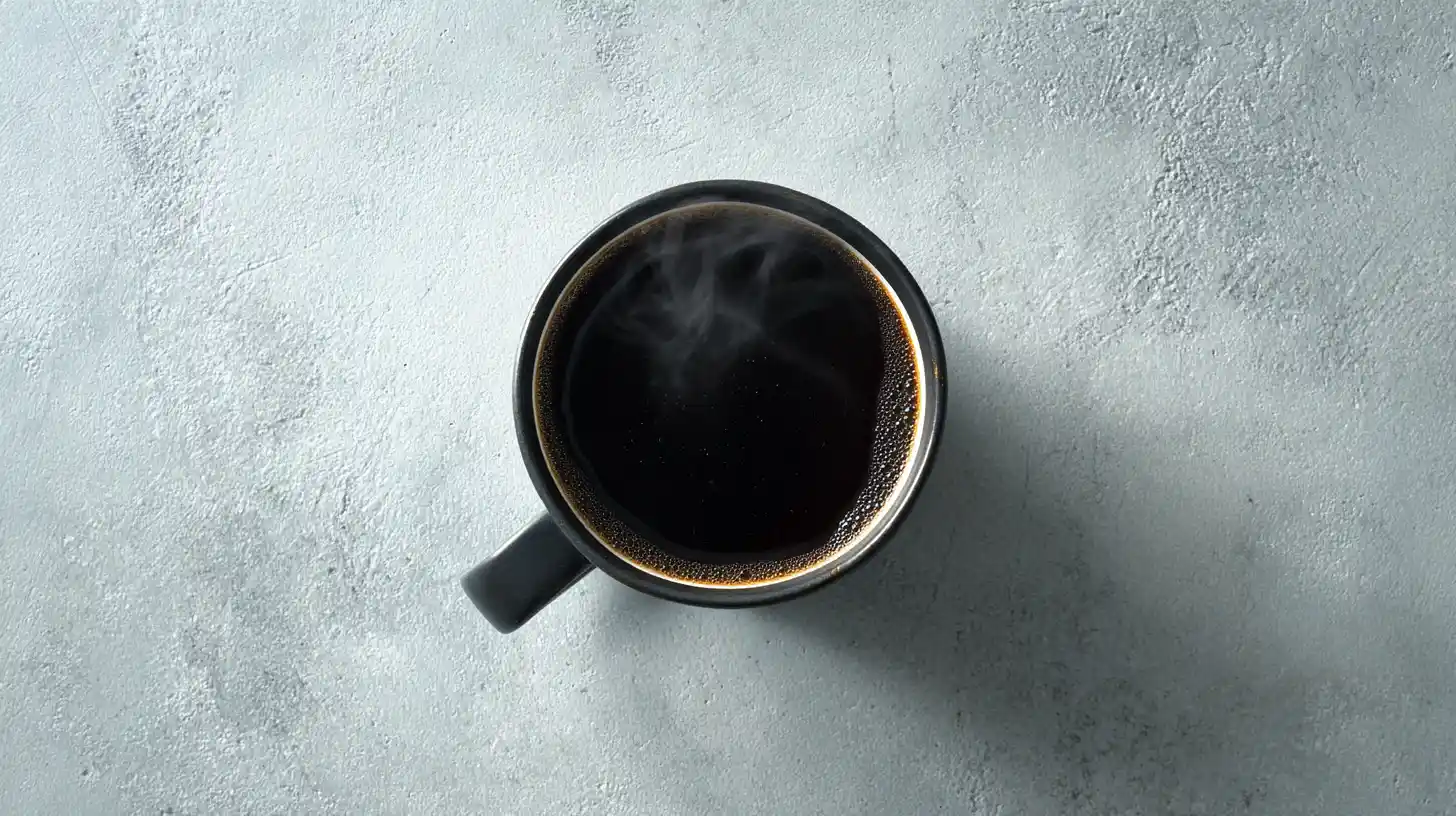 Black coffee mug with steam rising, representing the pause to assess what is broken before starting digital marketing work